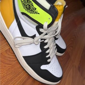 Black and White High-Top Sneakers with Yellow Accents